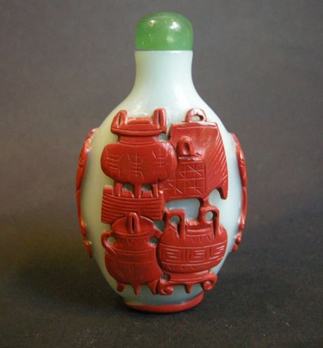 Snuff Bottles : Snuff bottle glass overlay red cinnabar on light blue background .Chine 1780/1830- 