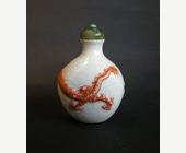 Snuff Bottles : snuff bottle porcelain with a low relief a Dragon in iron red 
Mark and period Daoguang  1821/1850