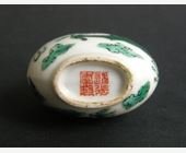 Snuff Bottles : Snuff bottle porcelain decorated with a green Dragon  -Imperial kilns of Jingdezhen  seal mark Daoguang  1821/1850  and in the  period -