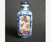 Snuff Bottles : snuff bottle porcelain quadrangular shape  decorated in underglaze blue with prunus flowers and for panels in copper red  with birds and insects in a landscape - Circa 19th century