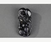 Works of Art : Pendant nephite black and white carved in the shape of two bats with double gourds and their foliage 
Circa 1900