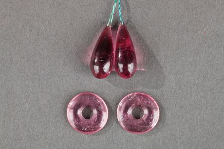 Works of Art : Four Chinese tourmaline pendant ,two drop-shapedand two ring-shaped .Circa 1900 -