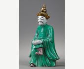 Works of Art : Figure seated in biscuit "Famille verte" with a golden bronze headdress -  19 th century
the bronze probably occidental