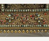 Works of Art : Rare votive wall plate in wood finely covered with filigrees in gold metal and inlaid with turquoise cabochons, rock crystals, tourmalines and in the center a deesse in rock crystals and gold metal. Nepal 19thcentury around 1820