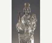 Works of Art : rock crystal figure representing a guanyin holding a vase and a flower - China around 1900
Wooden base