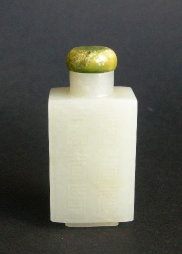 Snuff Bottles : Rectangular shaped light green jade snuff bottle carved on each side with shou signs. 1750/1850