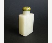 Snuff Bottles : Rectangular shaped light green jade snuff bottle carved on each side with shou signs. 1750/1850