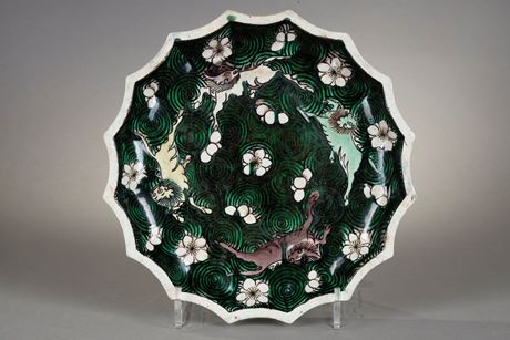 Polychrome : Dish biscuit Famille verte  decorated with qilin on a background of waves - Circa 18/19 th