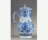Blue White :  blue and white porcelain jug and cover decorated with butterfly birds flowers and lambrequins in the taste of Delft . On the cover the dog shape - China epoque Kangxi 1662/1722 around 1700 1720