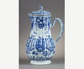 Blue White :  blue and white porcelain jug and cover decorated with butterfly birds flowers and lambrequins in the taste of Delft . On the cover the dog shape - China epoque Kangxi 1662/1722 around 1700 1720