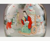 Snuff Bottles : Rock crystal snuff bottle painted in its interior of Zhong Kui surrounded by demons on one side and on the other the sister of Zhong Kui on a char signed by Ye Zhongsan and dated 1919