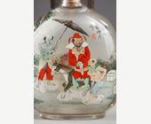 Snuff Bottles : Rock crystal snuff bottle painted in its interior of Zhong Kui surrounded by demons on one side and on the other the sister of Zhong Kui on a char signed by Ye Zhongsan and dated 1919