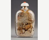 Snuff Bottles : -Snuff bottle in glass inside painted with a rider and his servant with calligraphy on one side and on the other of a camel man and camel  -Signed by Gui Xianggu and dated 1899 
