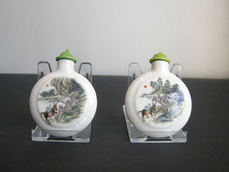 Snuff Bottles : two porcelain snuff bottles in the form of watches painted in polychrome landscapes in the style of traditional Chinese painting. China 19th century