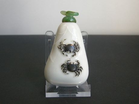 Snuff Bottles : Porcelain snuff bottle of peeble shape decorated in light relief of two crabs and aquatic plants -1820/1880