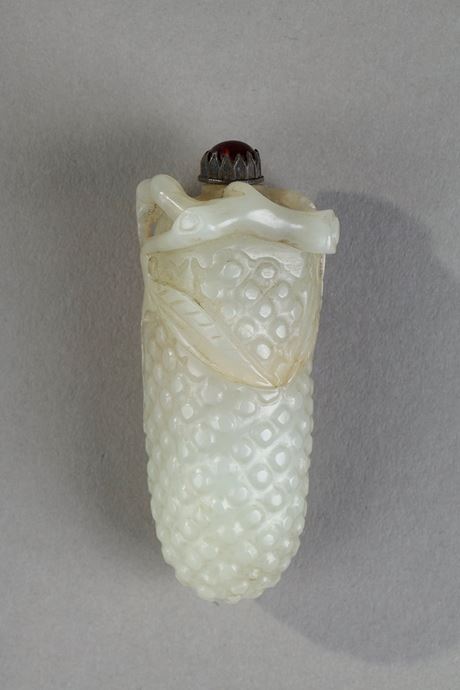 Snuff Bottles : Nephrite jade snuffbottle carved in the shape of fruit branch in high relief and leaves around the opening of the bottle   - China 19th century