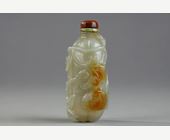 Snuff Bottles : Celadon green nephrite jade snuffbottle in the shape of .pumpkin with its leaves and another small fruit in a reddish brown inclusion - China 19th century