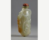 Snuff Bottles : Celadon green nephrite jade snuffbottle in the shape of .pumpkin with its leaves and another small fruit in a reddish brown inclusion - China 19th century