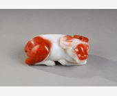 Works of Art : Statuette in white and rust carnelian representing a recumbent buffalo. China 19th century
10 cm long