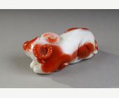 Works of Art : Statuette in white and rust carnelian representing a recumbent buffalo. China 19th century
10 cm long