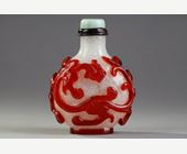 Snuff Bottles : Beautiful red glass snuffbottle overlay on bully background adorned on each side of a dragon shi China 1750/1820