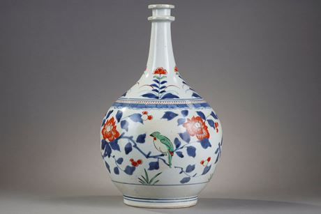 Japanese : Bottle pharmacy with double ring collar. porcelain decorated in blue under cover and polychrome enamels of birds among the branches of pomegranate peony and camellia Japan  Arita  kilns late 17th century