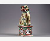 Polychrome : figure representing a Buddhist lion in enameled biscuit yellow ,green and  iron red China Qing period  18/19th century