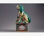Polychrome : figure representing a Buddhist lion in enameled biscuit yellow ,green and  iron red China Qing period  18/19th century