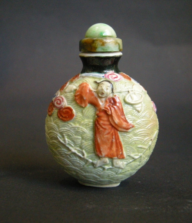 Snuff Bottles : Rare porcelain snuff bottle molded  probably immortal He Xiangu  - 19th century -
