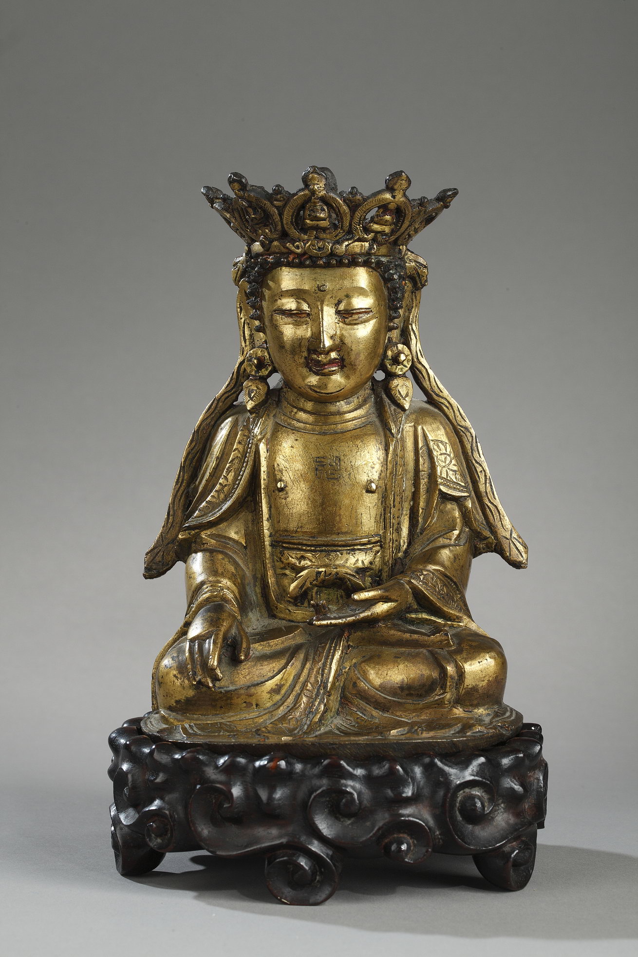 Works of Art : Figure of Bodhisattva  Gold bronze and sitting in padmasana  the hands in bhumisparsa mudra -
Ming period 1600/1640 - (H 17,5cm)
Wood stand 

