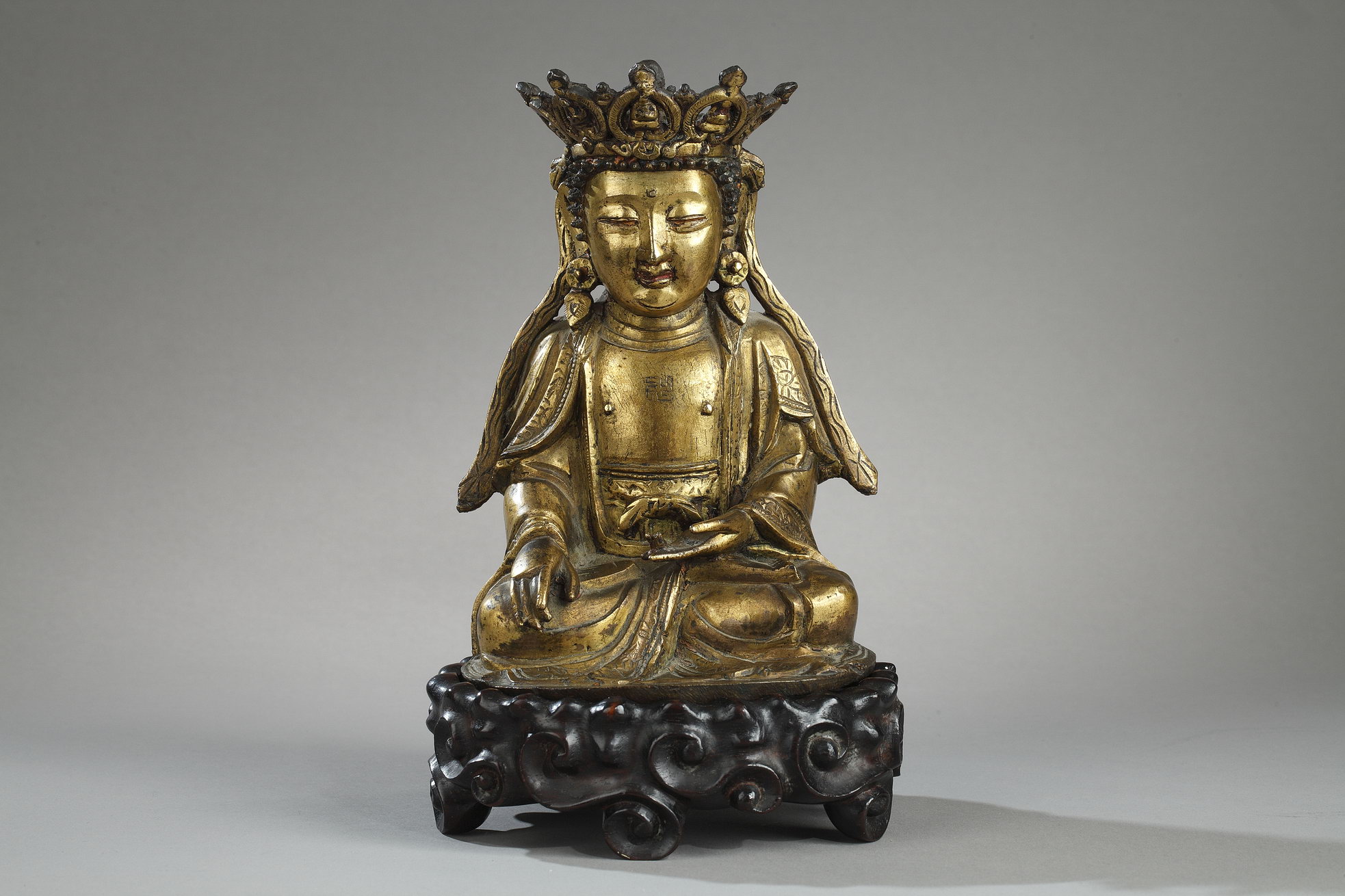 Works of Art : Figure of Bodhisattva  Gold bronze and sitting in padmasana  the hands in bhumisparsa mudra -
Ming period 1600/1640 - (H 17,5cm)
Wood stand 
