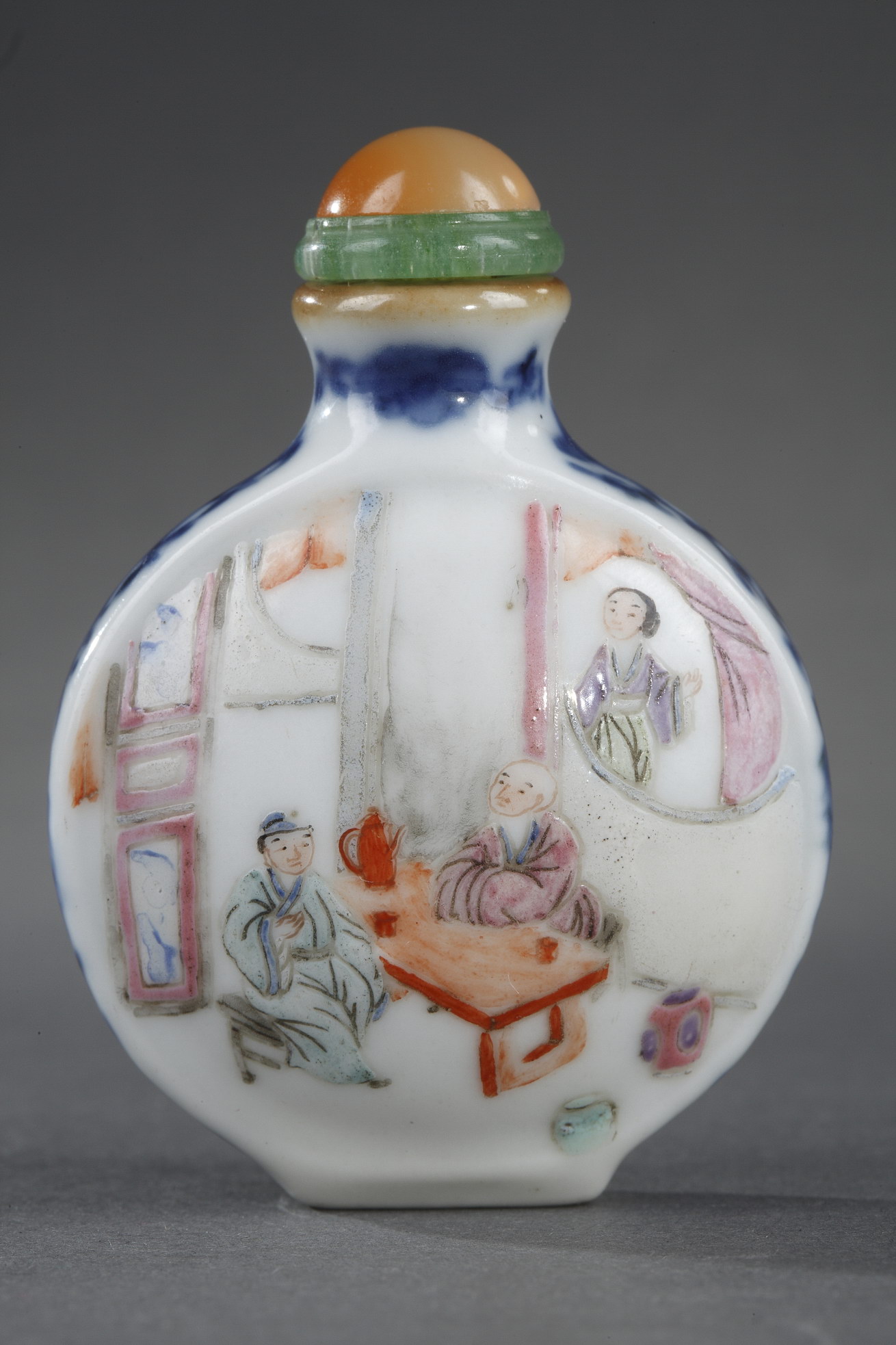 Snuff Bottles : Chinese polychrome porcelain  snuff bottle with interiors scenes the sides decorated underglaze blue scrolls
Imperial kilns Jingdezhen mark and period Jiaqing 1796/1820
H. 5,2cm
