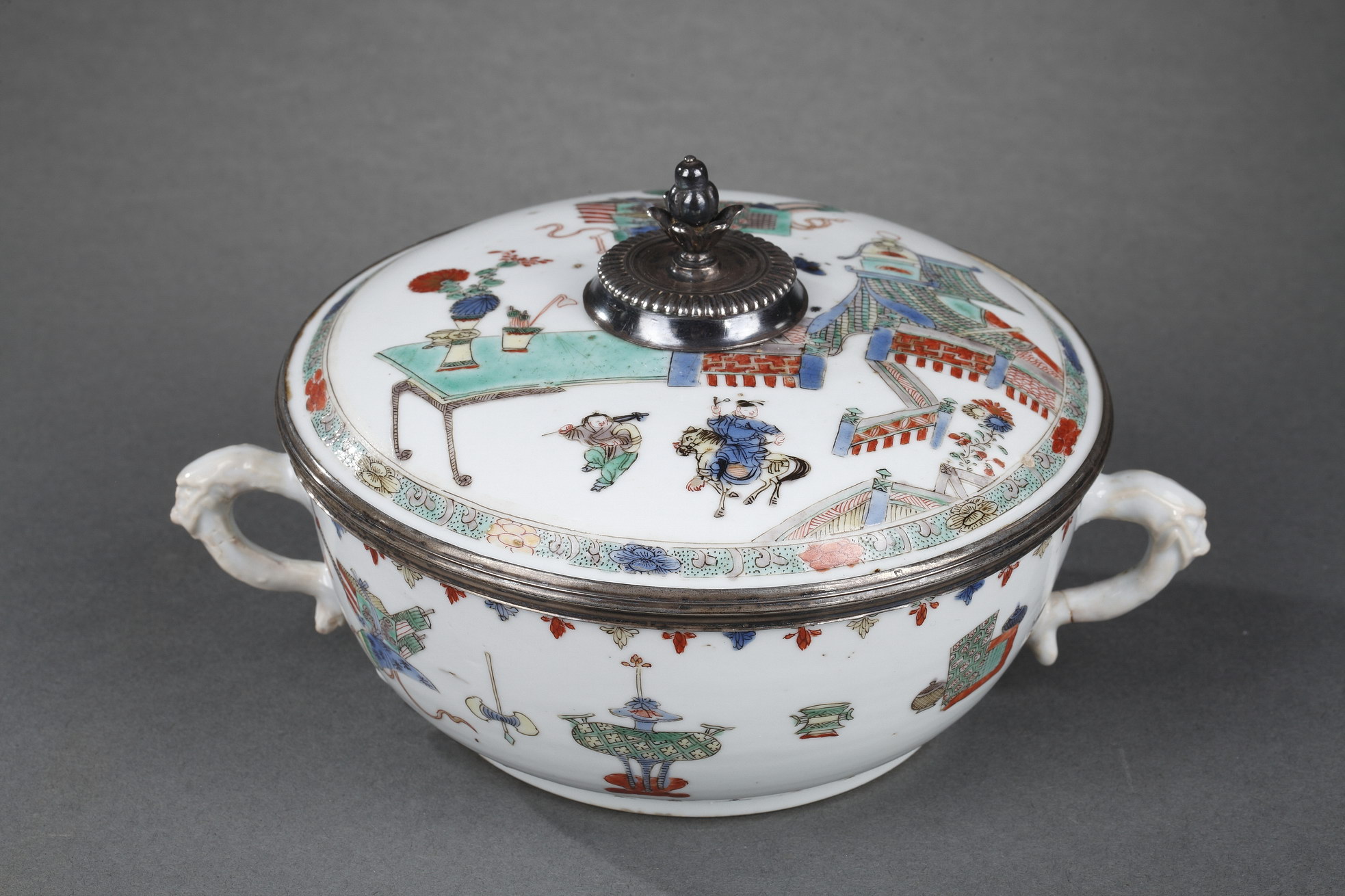Works of Art : Chinese Famille verte porcelain covered bowl with handles ,decorated with a horseman and his servant leaving a walled city and precious objects on the cover and the bowl - Kangxi period 1662/1722
old western silver mount.
