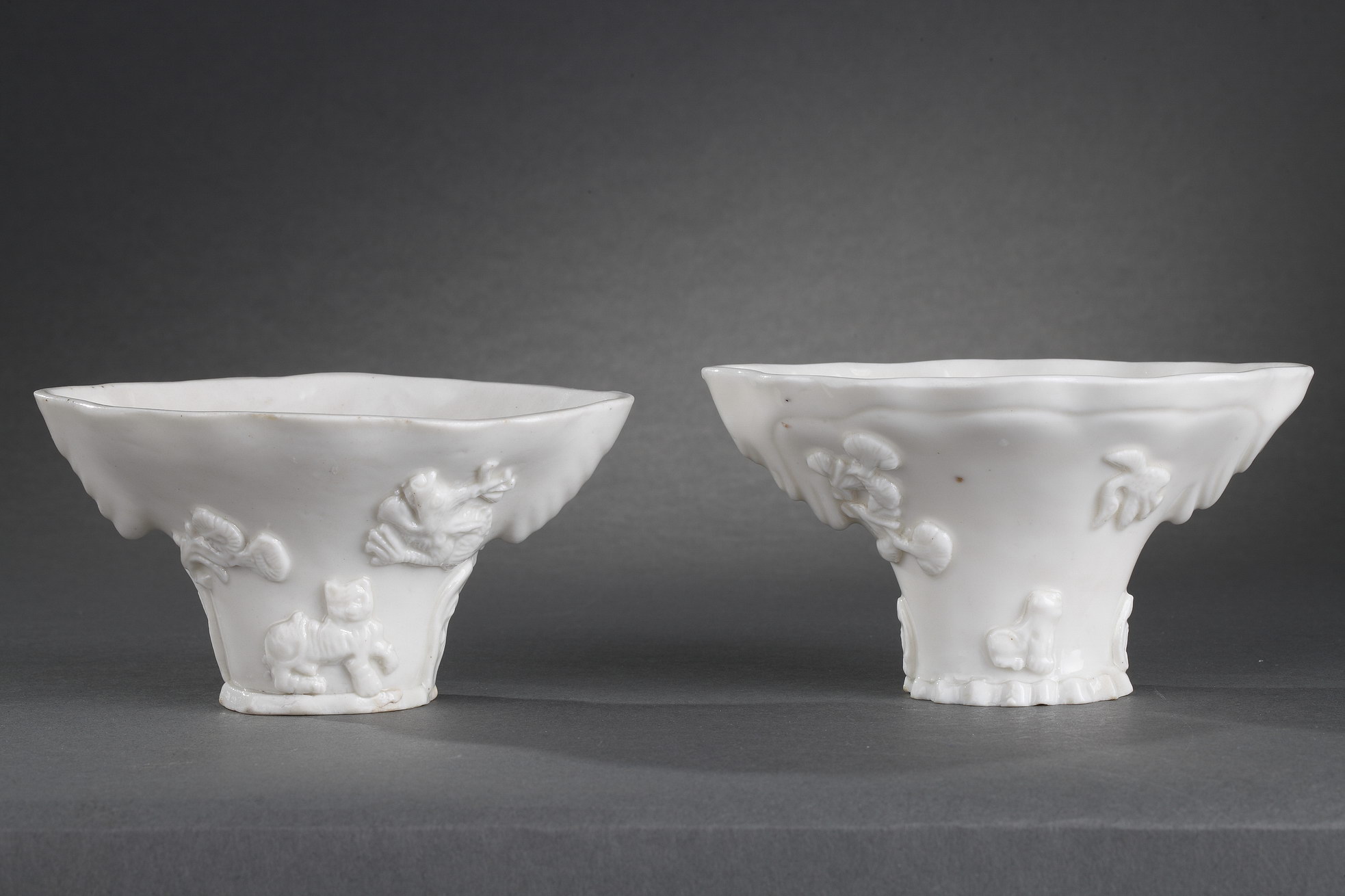 Blue White : Pair of "blanc de Chine" rhinoceros horn shaped cups with animals decoration like : tiger dragon deer or crane.
Dehua kilns (Fujian province) Kangxi period (1662/1722)