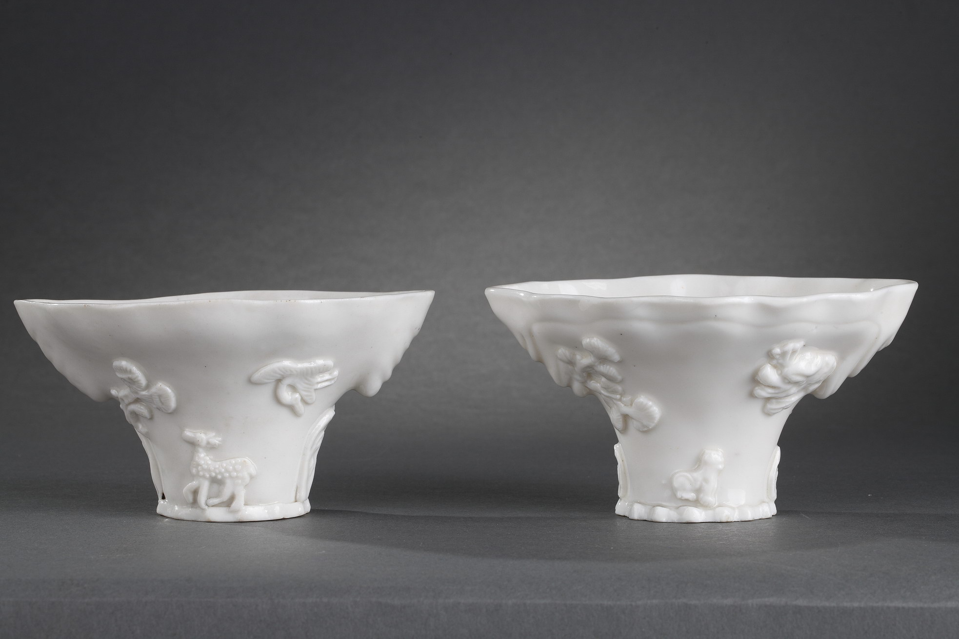 Blue White : Pair of "blanc de Chine" rhinoceros horn shaped cups with animals decoration like : tiger dragon deer or crane.
Dehua kilns (Fujian province) Kangxi period (1662/1722)