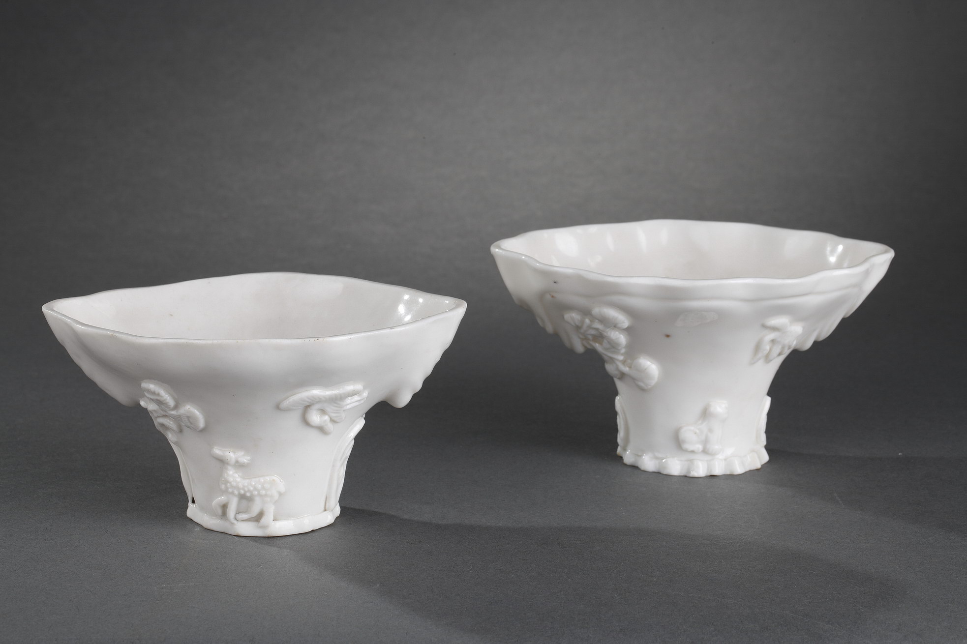 Blue White : Pair of "blanc de Chine" rhinoceros horn shaped cups with animals decoration like : tiger dragon deer or crane.
Dehua kilns (Fujian province) Kangxi period (1662/1722)