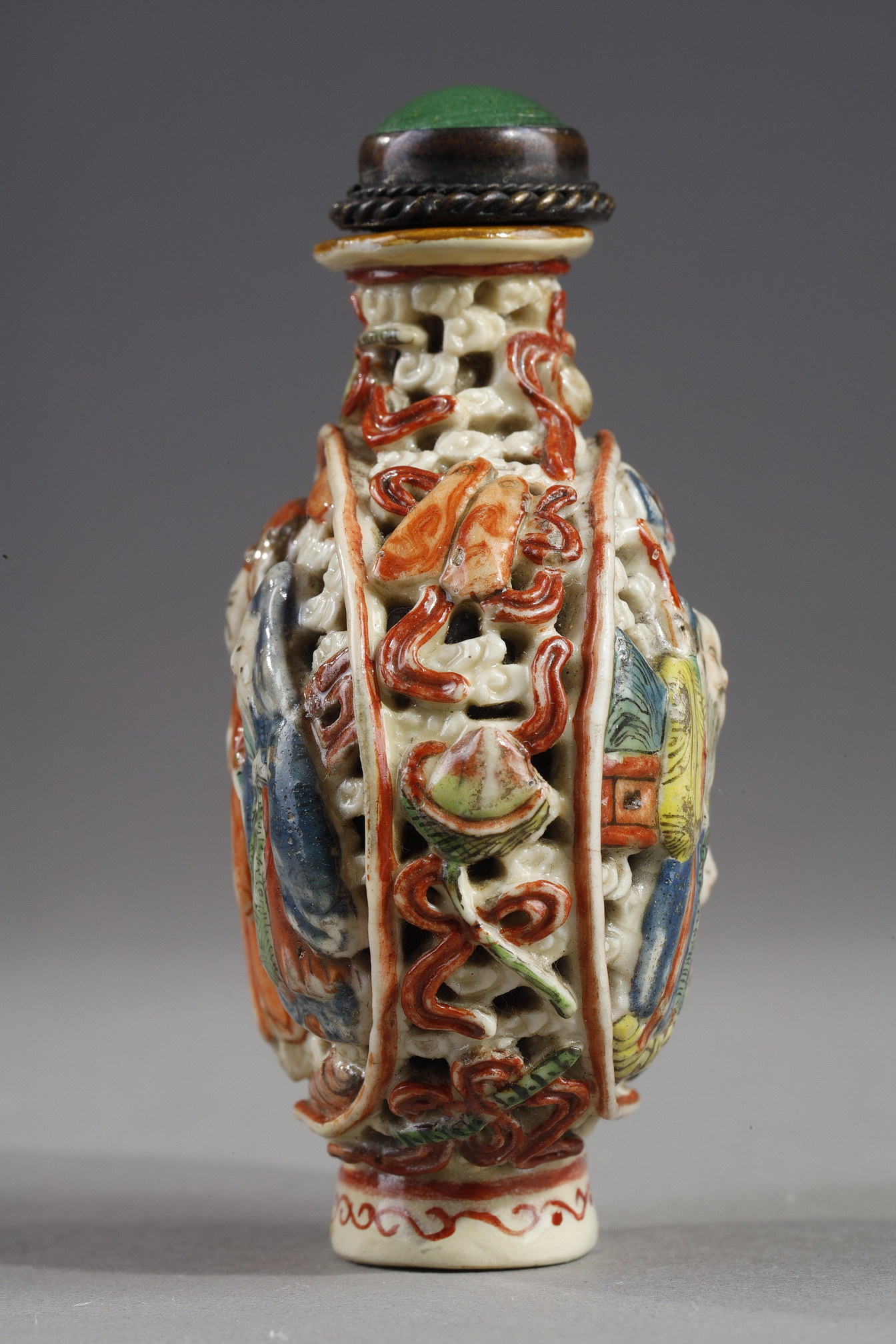 Snuff Bottles : Snuff bottle porcelain molded and reticulated with decor Shou Lao deer and children on a face  and other face with two figures and children  and Buddhist emblems on the sides - Imperial Jingdezhen kilns  Jiaqing mark and period 1796/1820