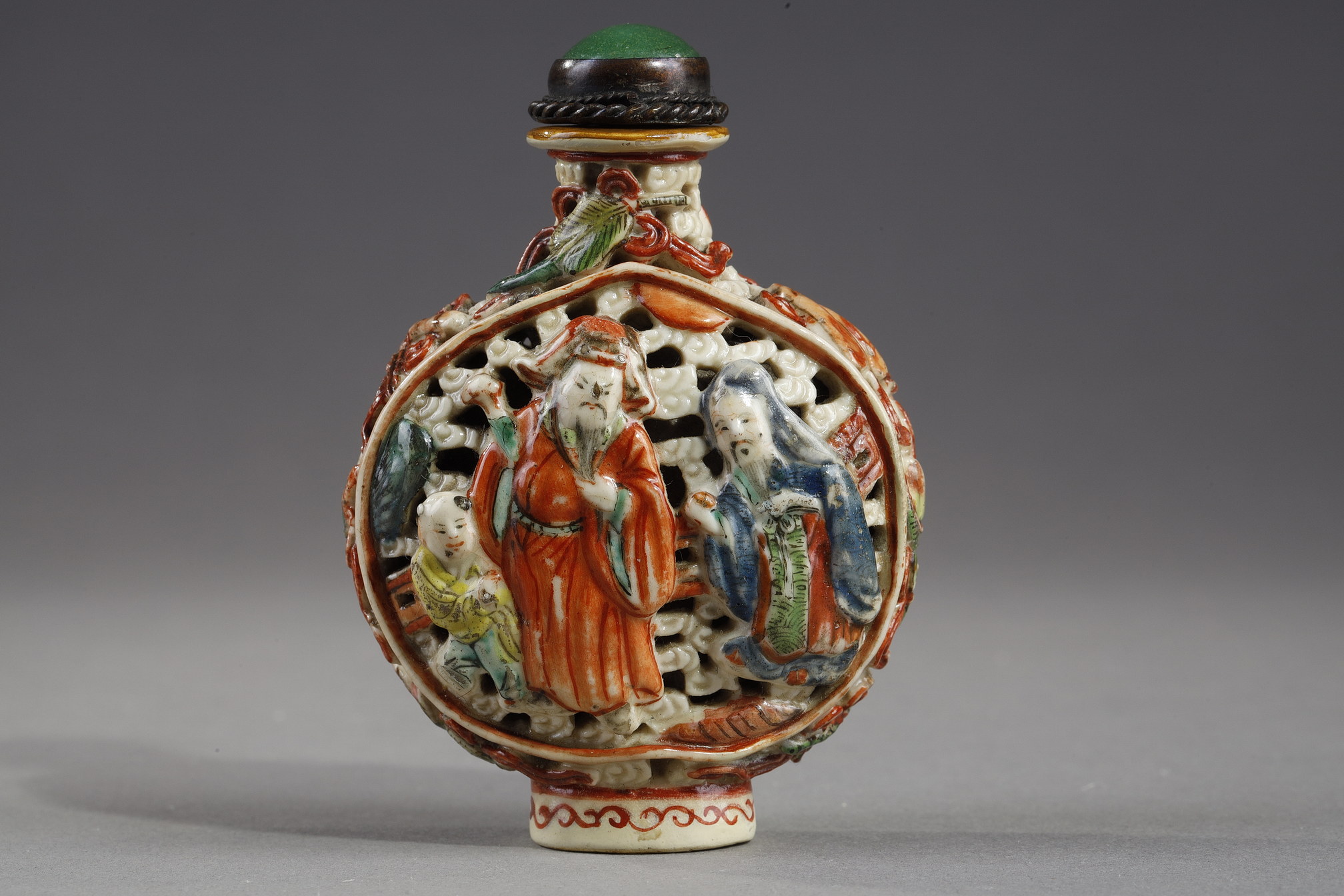 Snuff Bottles : Snuff bottle porcelain molded and reticulated with decor Shou Lao deer and children on a face  and other face with two figures and children  and Buddhist emblems on the sides - Imperial Jingdezhen kilns  Jiaqing mark and period 1796/1820