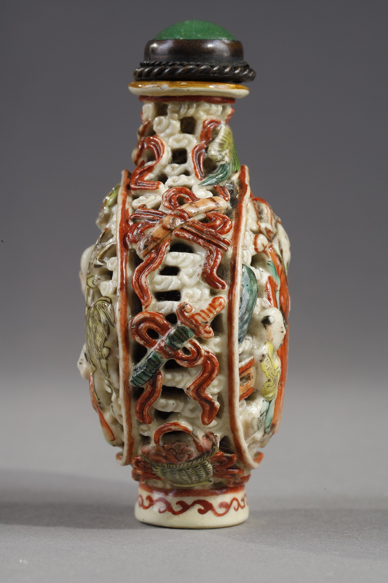 Snuff Bottles : Snuff bottle porcelain molded and reticulated with decor Shou Lao deer and children on a face  and other face with two figures and children  and Buddhist emblems on the sides - Imperial Jingdezhen kilns  Jiaqing mark and period 1796/1820