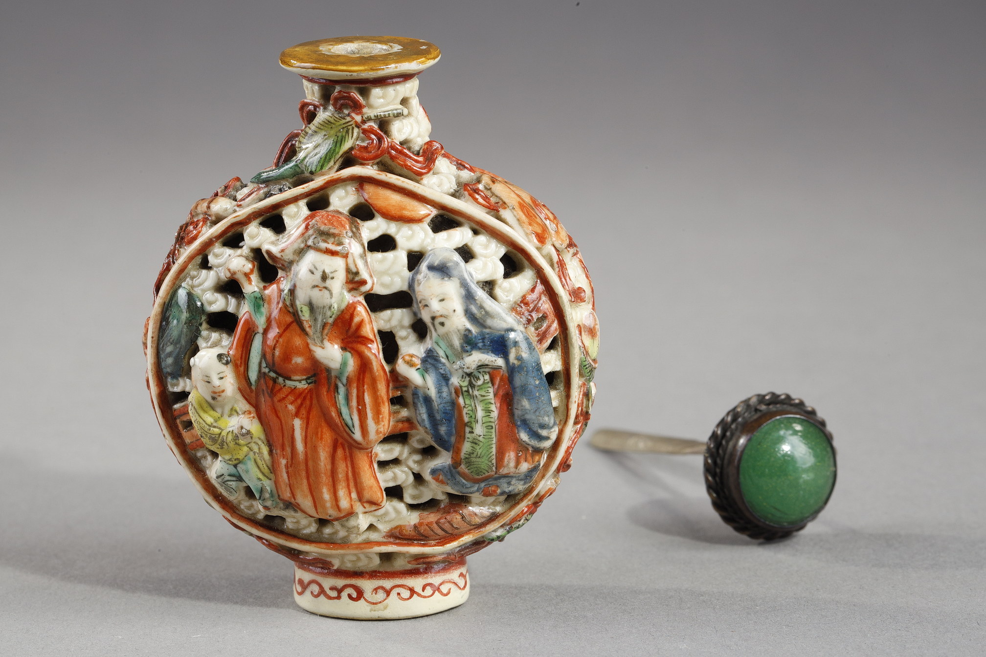 Snuff Bottles : Snuff bottle porcelain molded and reticulated with decor Shou Lao deer and children on a face  and other face with two figures and children  and Buddhist emblems on the sides - Imperial Jingdezhen kilns  Jiaqing mark and period 1796/1820
