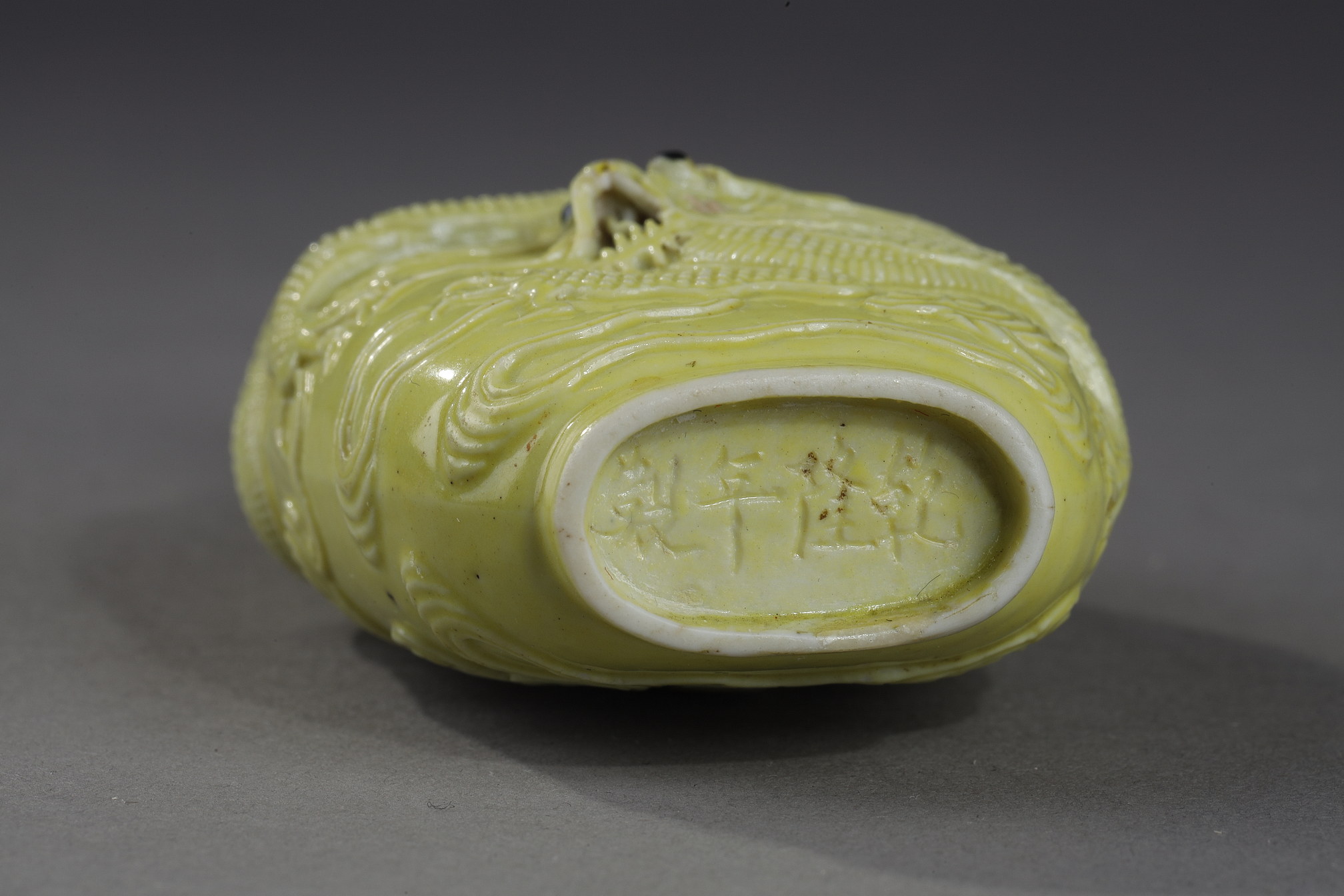 Snuff Bottles : snuff bottle porcelain enamelled yellow molded and sculpted with a dragon - Qianlong mark - 
School of Wang Bingrong - circa 1850