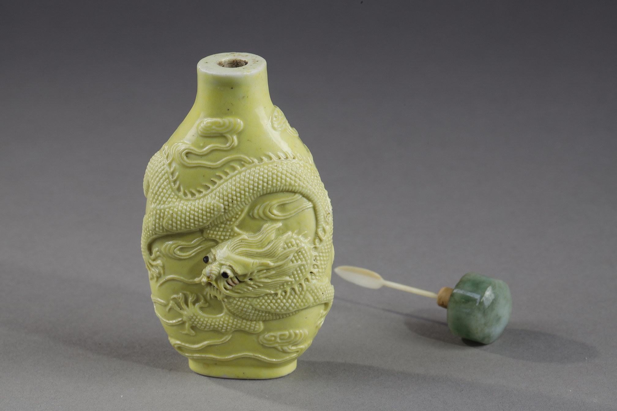 Snuff Bottles : snuff bottle porcelain enamelled yellow molded and sculpted with a dragon - Qianlong mark - 
School of Wang Bingrong - circa 1850