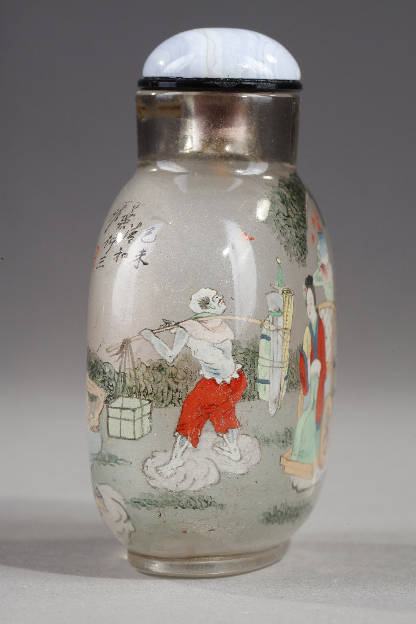 Snuff Bottles : Rock crystal snuff bottle painted in its interior of Zhong Kui surrounded by demons on one side and on the other the sister of Zhong Kui on a char signed by Ye Zhongsan and dated 1919