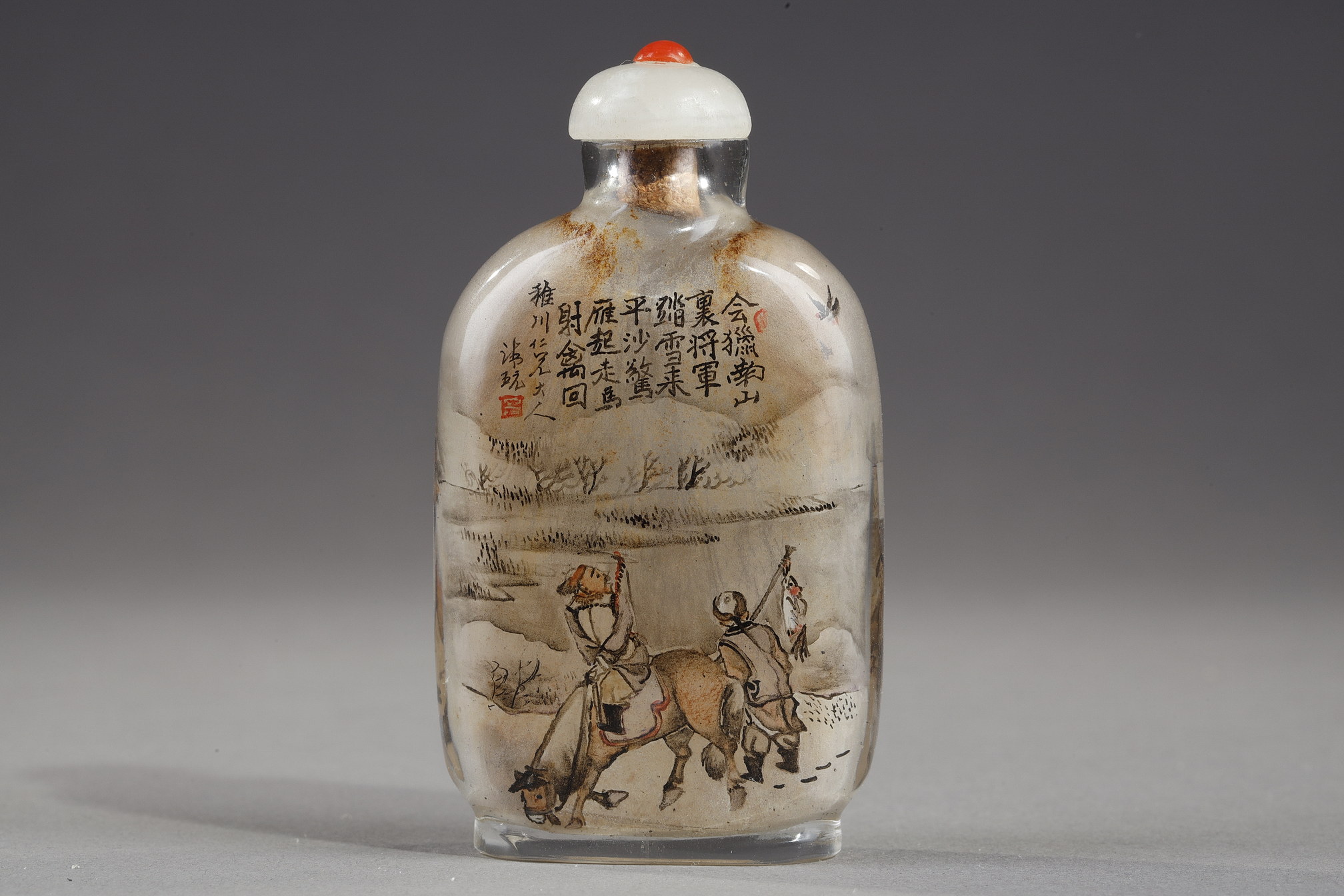 Snuff Bottles : -Snuff bottle in glass inside painted with a rider and his servant with calligraphy on one side and on the other of a camel man and camel  -Signed by Gui Xianggu and dated 1899 