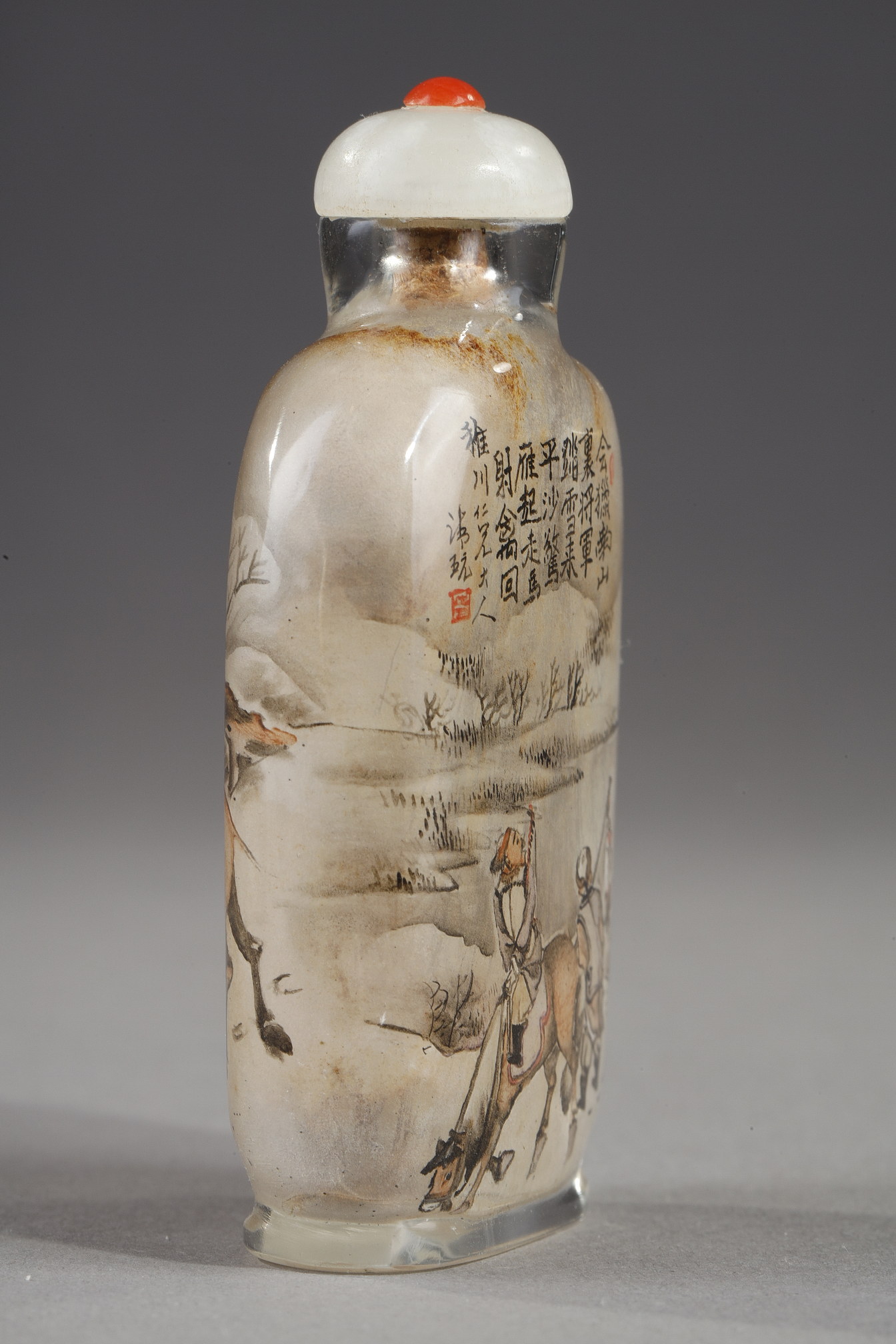 Snuff Bottles : -Snuff bottle in glass inside painted with a rider and his servant with calligraphy on one side and on the other of a camel man and camel  -Signed by Gui Xianggu and dated 1899 