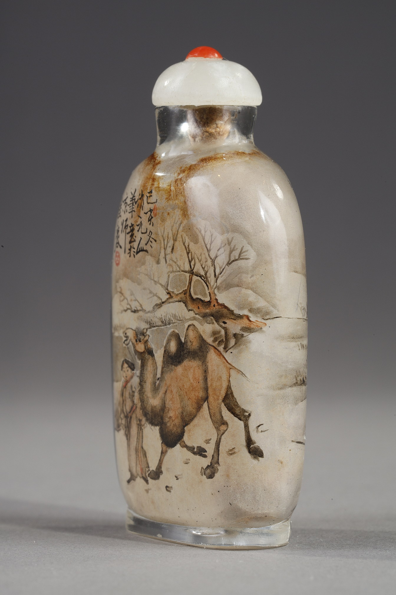 Snuff Bottles : -Snuff bottle in glass inside painted with a rider and his servant with calligraphy on one side and on the other of a camel man and camel  -Signed by Gui Xianggu and dated 1899 