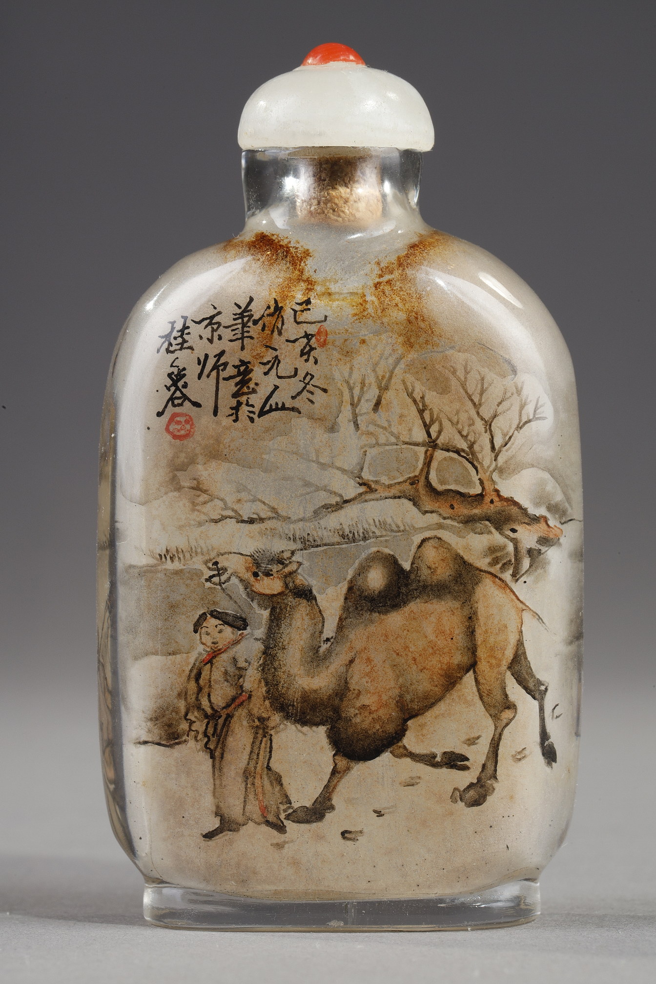 Snuff Bottles : -Snuff bottle in glass inside painted with a rider and his servant with calligraphy on one side and on the other of a camel man and camel  -Signed by Gui Xianggu and dated 1899 