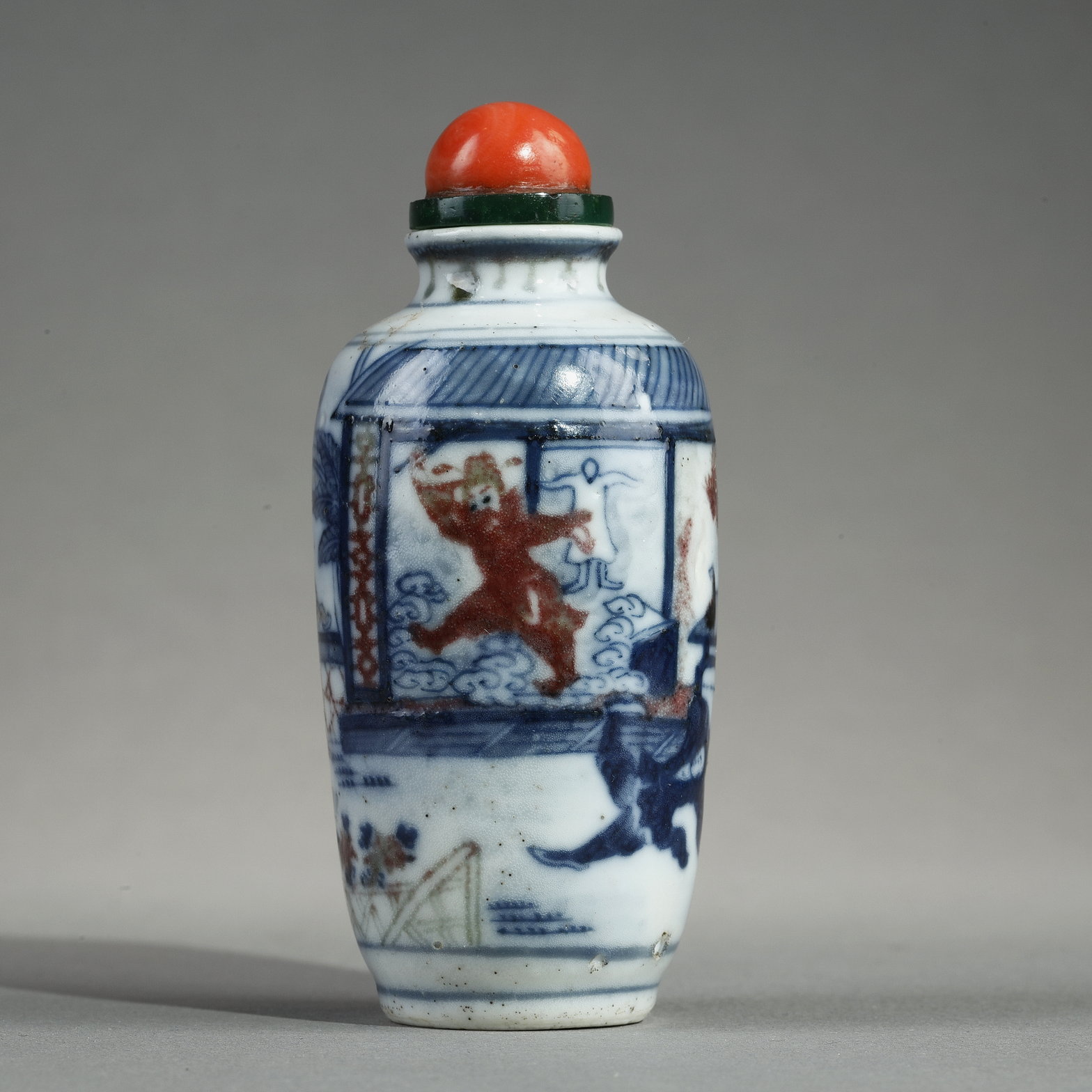 Snuff Bottles : Enameled snuff bottle painted in underglaze blue  and red copper with a decor of an interior scene with
the ghostly "Gui" - Apocryphal mark Qianlong - 19th century China