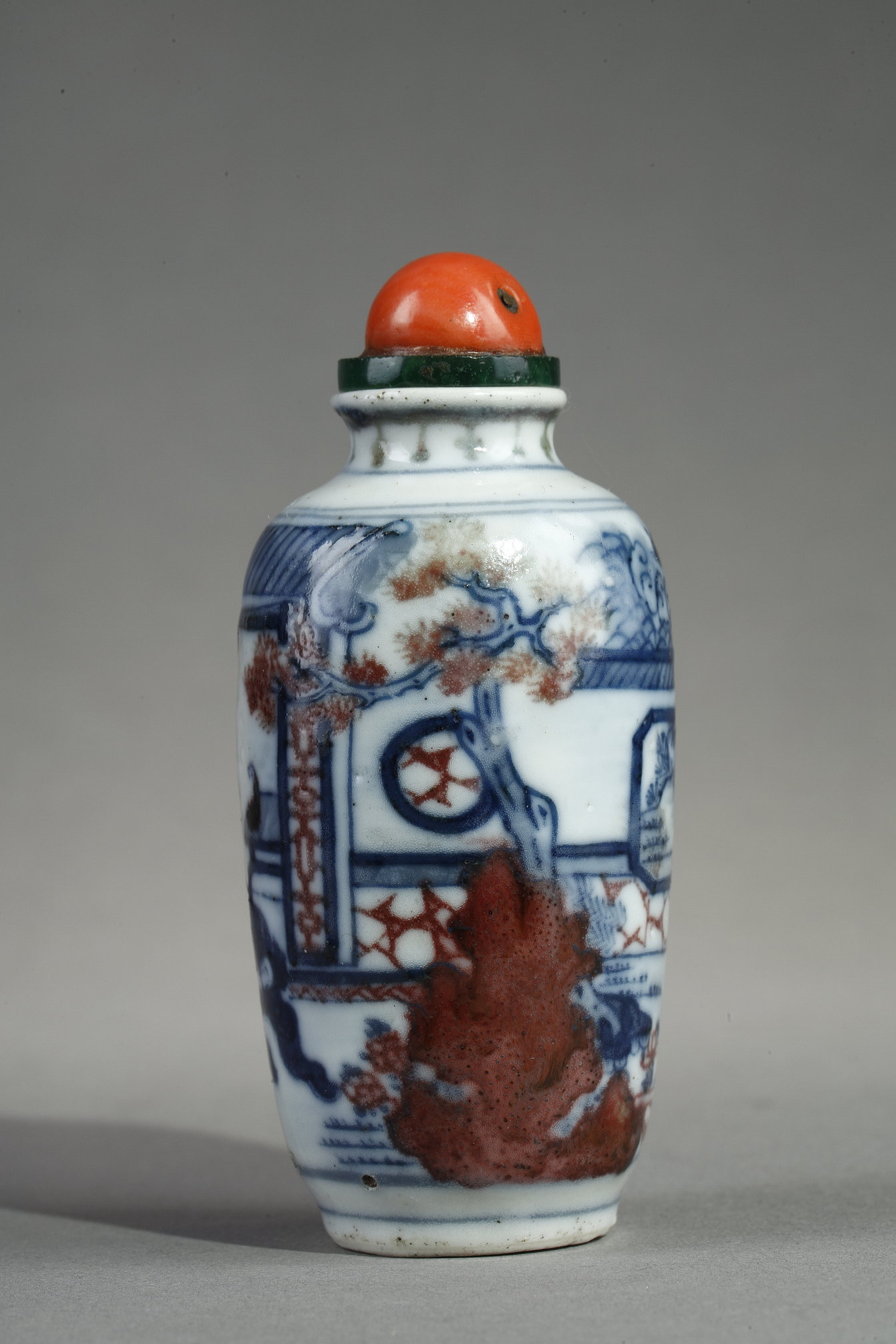 Snuff Bottles : Enameled snuff bottle painted in underglaze blue  and red copper with a decor of an interior scene with
the ghostly "Gui" - Apocryphal mark Qianlong - 19th century China