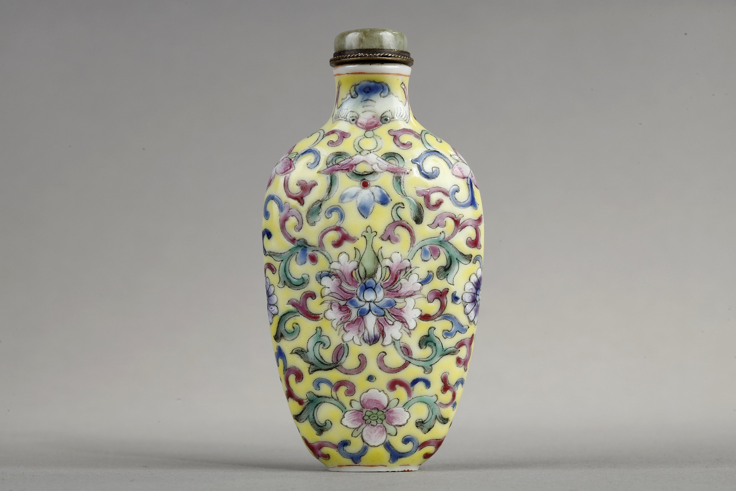 Snuff Bottles : Snuff bottle porcelain has a polychrome decor of stylized flowers and foliage.
China 1890/1930
